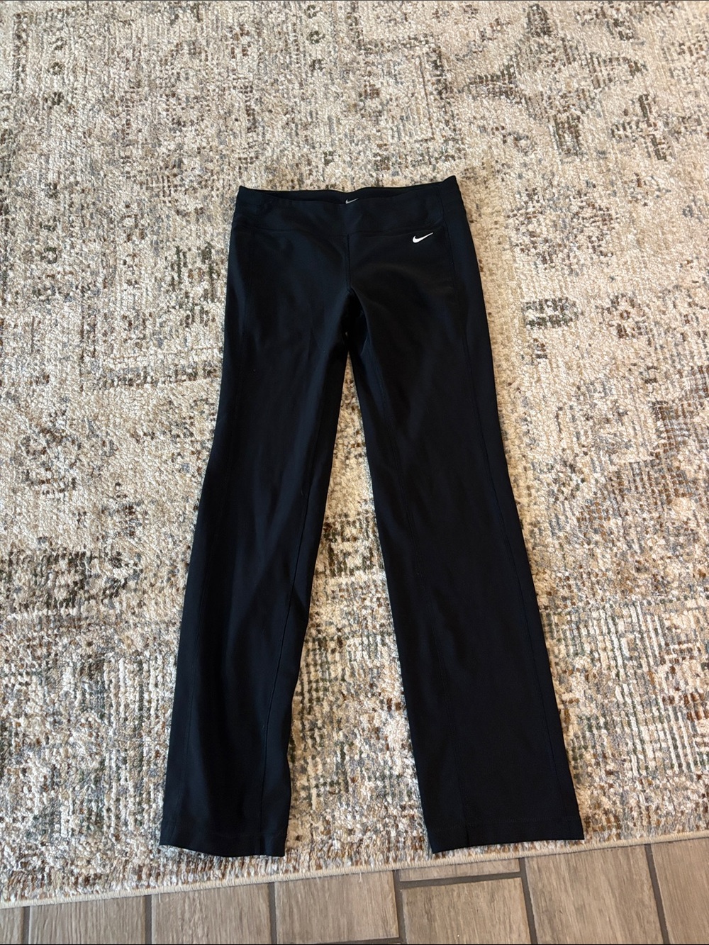 Nike Black women' Flared Sweatpants with White Swoosh Logo